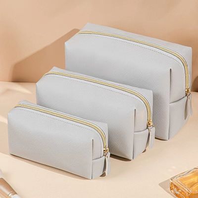 Borsa igienica in pelle vegana con chiusura a cerniera in colore personalizzato per viaggi e cosmetici