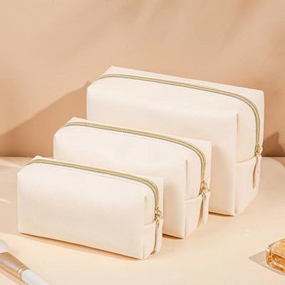 Borsa igienica in pelle vegana con chiusura a cerniera in colore personalizzato per viaggi e cosmetici