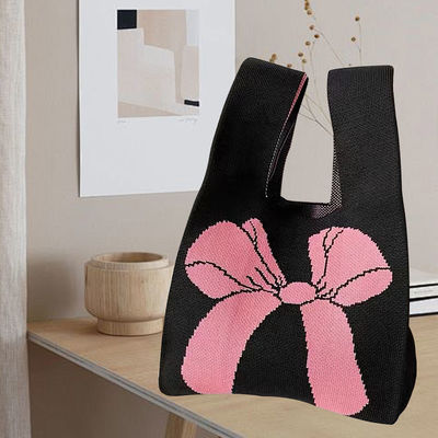 Disegno di sacchetto di tote personalizzato tessuto di cotone organico a maglia con nodo di arco ecologico