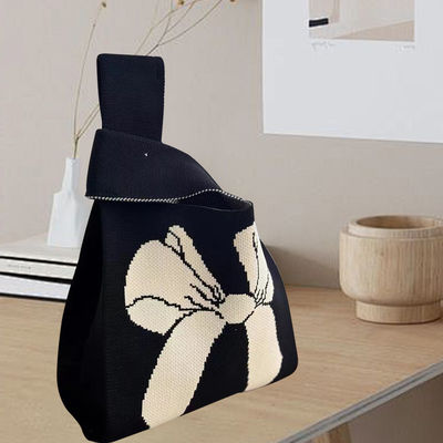 Disegno di sacchetto di tote personalizzato tessuto di cotone organico a maglia con nodo di arco ecologico