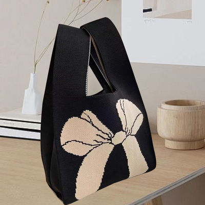 Disegno di sacchetto di tote personalizzato tessuto di cotone organico a maglia con nodo di arco ecologico