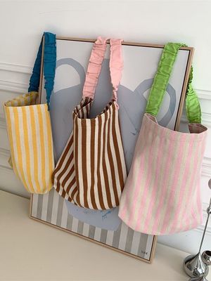 Borsa da spalla in tela da due maniche con strisce contraddistinte accattivanti
