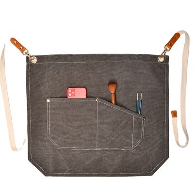 Uomini che lavorano sul grembiule con tasche di attrezzi e colore personalizzato su tela a mezzo corpo