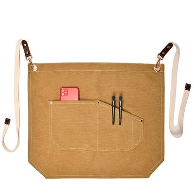 Uomini che lavorano sul grembiule con tasche di attrezzi e colore personalizzato su tela a mezzo corpo