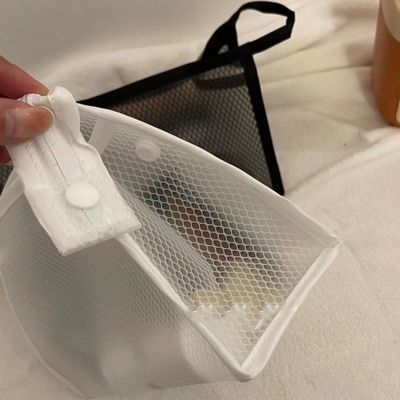 Tasca di trucco in maglia di nylon semplice personalizzata per la conservazione di articoli igienici e cosmetici in colore nero