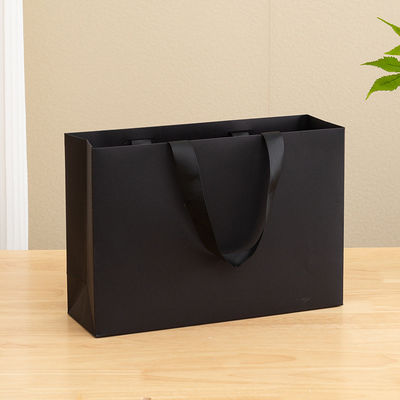 Borse di carta stampate su misura Borsa regalo di carta kraft bianca di lusso per borsa da shopping