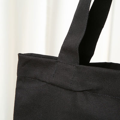 Sacchetto di cotone di tela ecologico nero semplice con logo stampato su misura