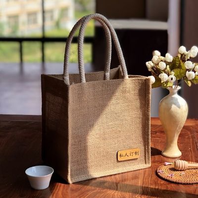 Sacchetti di giuta ecologici con logo stampato personalizzato e maniglie in pelle