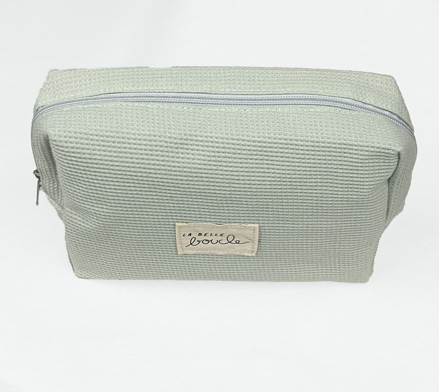 Borsa di trucco a strisce in corduroy per donne di moda.