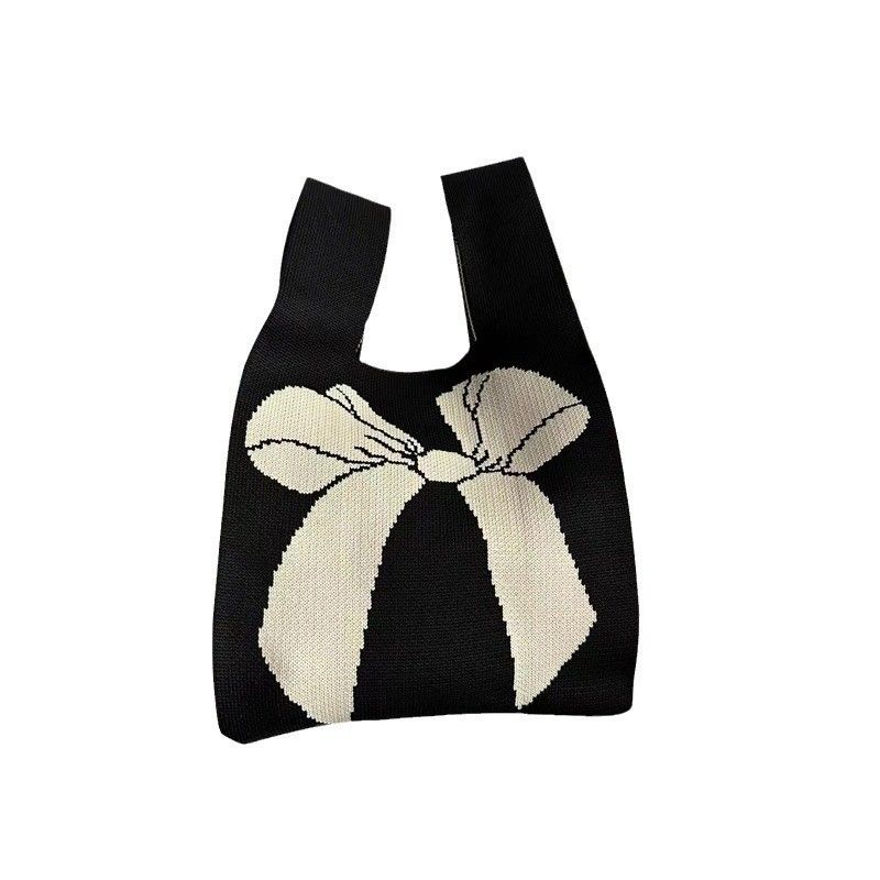 Disegno di sacchetto di tote personalizzato tessuto di cotone organico a maglia con nodo di arco ecologico